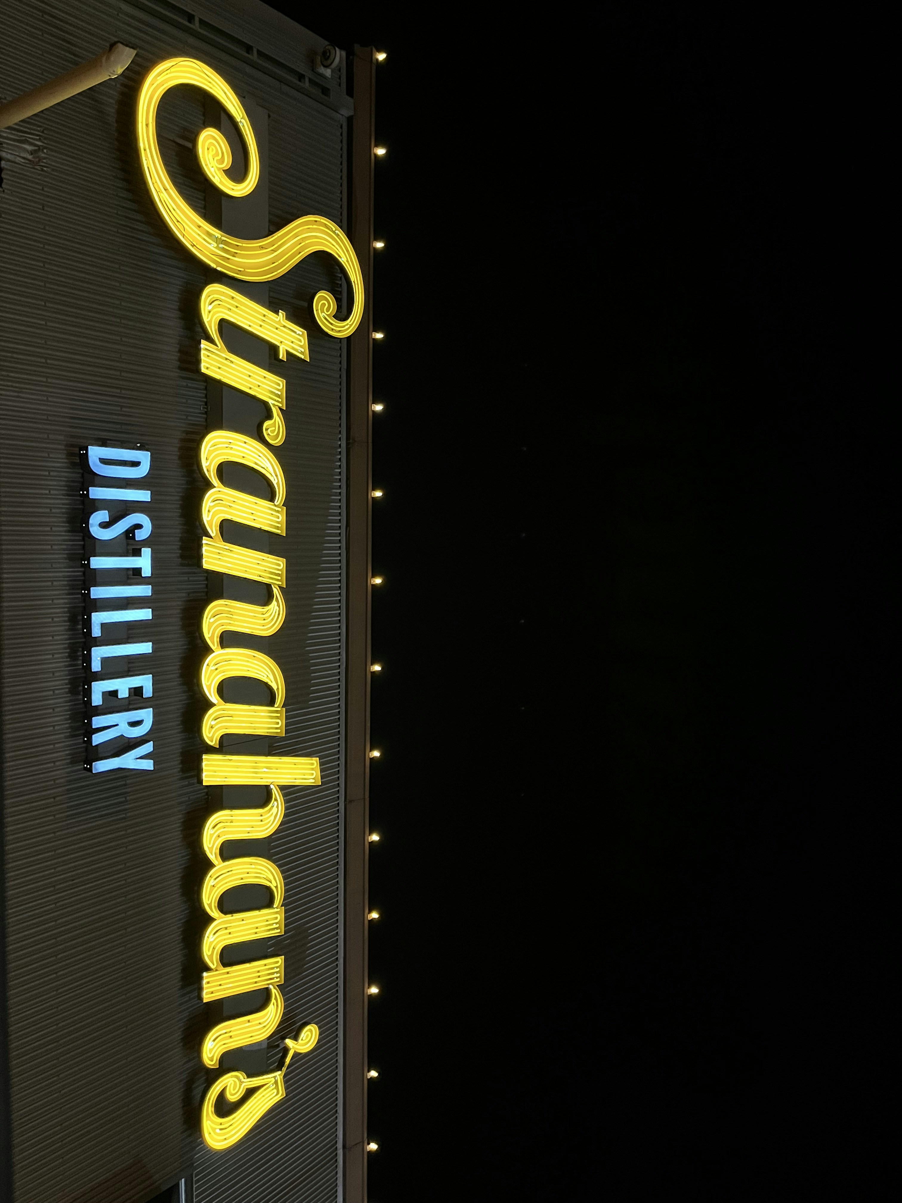 a sign with yellow text